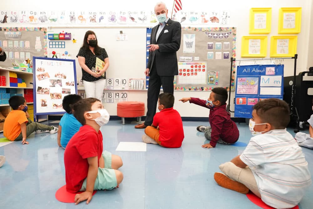 New Jersey Gov. Phil Murphy talks to students in a pre-K class at the Dr. Charles Smith Early Childhood Center in Palisades Park, N.J. (AP Photo/Mary Altaffer)