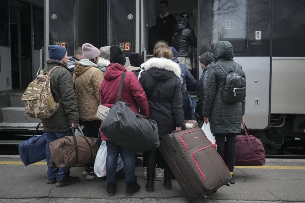 People board a Kiev bound train in Kostiantynivka, the Donetsk region, eastern Ukraine, Thursday, Feb. 24, 2022. Russia launched a wide-ranging attack on Ukraine on Thursday, hitting cities and bases with airstrikes or shelling, as civilians piled into trains and cars to flee. (Vadim Ghirda/AP)