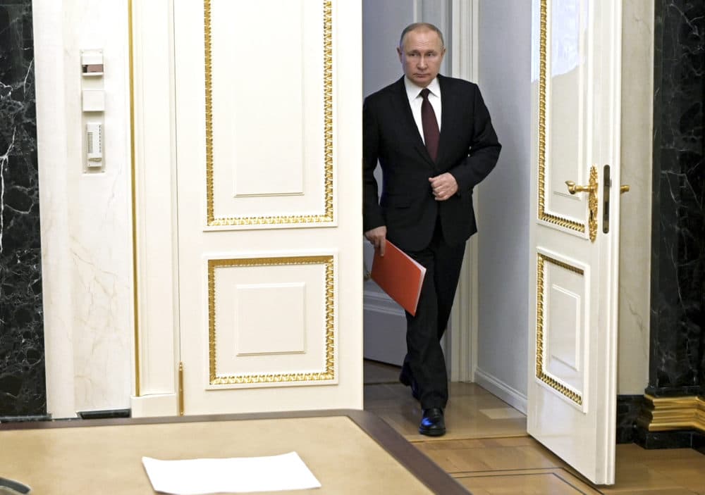 Russian President Vladimir Putin enters a hall to chair a Security Council meeting in Moscow, Russia, Friday, Feb. 25, 2022. (Alexei Nikolsky/Sputnik, Kremlin Pool Photo via AP)