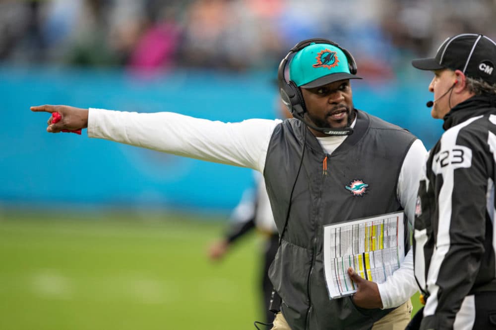 Brian Flores of the Miami Dolphins talks with a official during a game against the Tennessee Titans at Nissan Stadium on January 2, 2022 in Nashville, Tennessee. (Wesley Hitt/Getty Images)