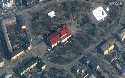 Satellite imagery of Mariupol, Ukraine, on March 14 showing the Mariupol Drama Theater which was bombed on March 16. The building had been used as a shelter for hundreds of Ukrainian civilians. Notably, on the March 14 satellite imagery, the word &quot;children&quot; is written in large white letters (in Russian) in front of and behind the theater. (Satellite image/Maxar Technologies via Getty Images)