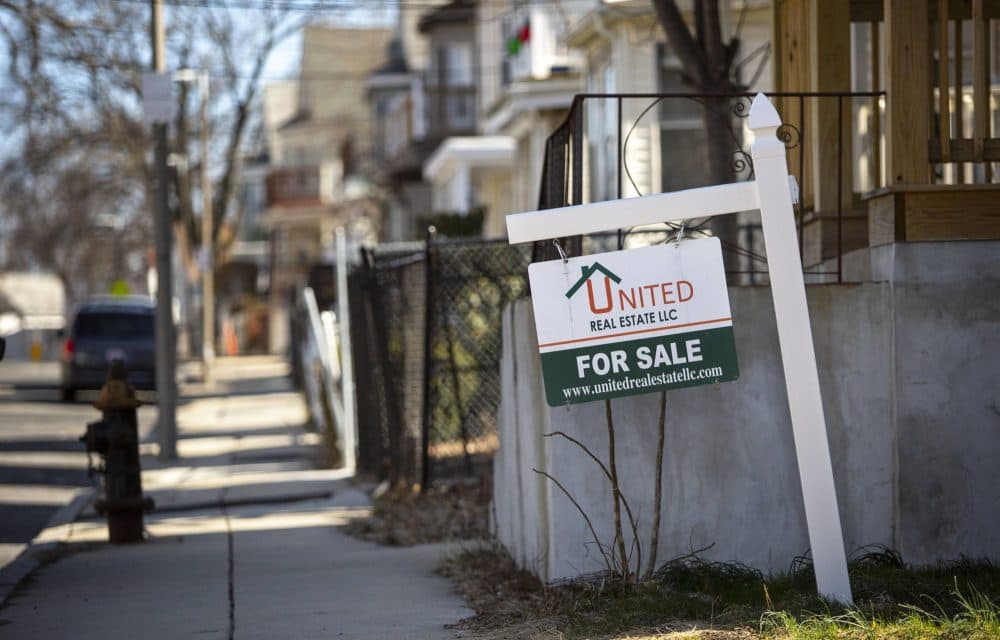 A &quot;for sale&quot; sign for a house on Ballou Avenue in Mattapan. (Robin Lubbock/WBUR)