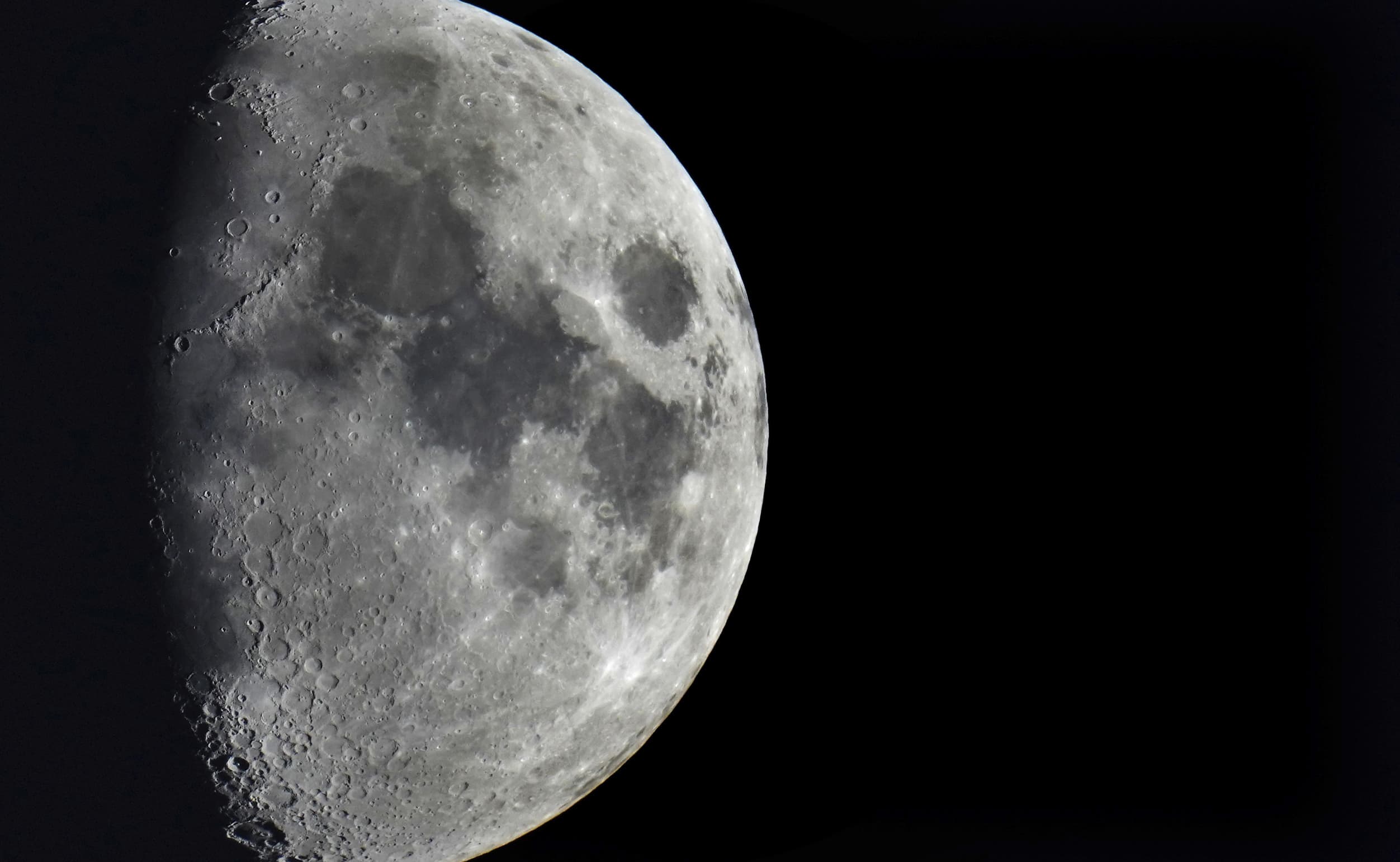 Impact craters cover the surface of the moon. And one more is on the way. (AP Photo/Michael Sohn, File)