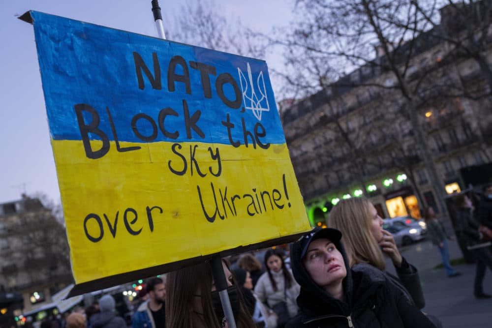 A protestor calls for on NATO to enforce a no-fly zone over the Ukraine during a demonstration in Paris, France, on Feb. 26, 2022. (Peter Dejong/AP)