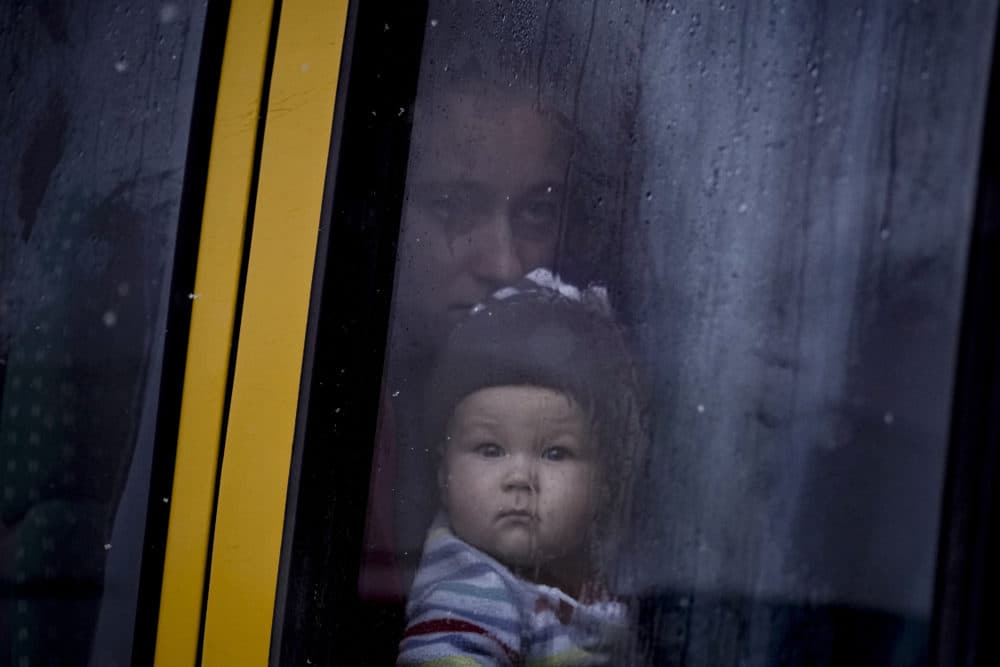 A woman and child who were evacuated from areas on the outskirts of the Ukrainian capital look out the window of a bus after arriving at a triage point in Kyiv, Ukraine, March 9, 2022. A Russian airstrike devastated a maternity hospital Wednesday in the besieged port city of Mariupol amid growing warnings from the West that Moscow's invasion is about to take a more brutal and indiscriminate turn. (Vadim Ghirda/AP)