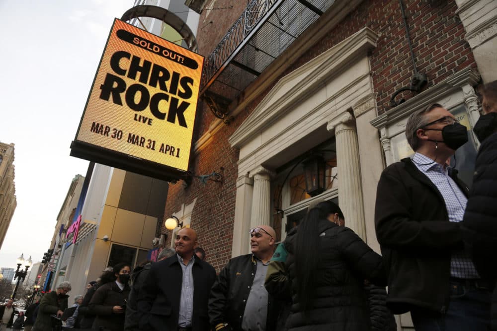 Ticket holders wait to enter The Wilbur Theatre for a performance by Chris Rock on Wednesday. (Mary Schwalm/AP)