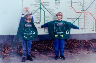 Sharon Brody's sons Campbell and Jack, many years ago, wearing the MBTA Green Line trolley Halloween costumes she made for them to their exacting specifications. (Sharon Brody/WBUR)