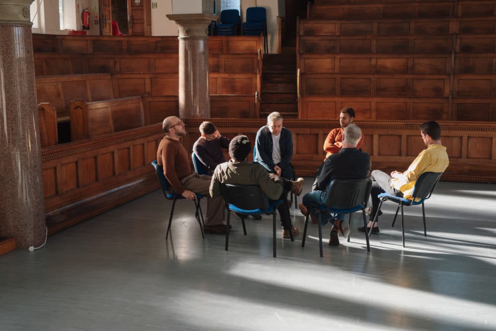 A men's therapy group in Hebden Bridge, West Yorkshire, United Kingdom. (Sarah Mason/Getty)