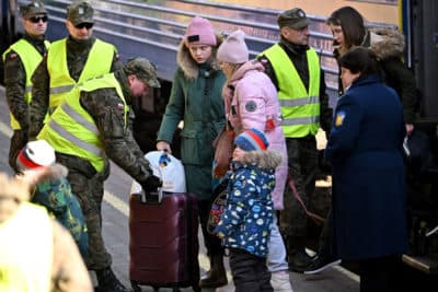 People, mainly women and children, arrive at Przemyśl train station on a train which came from Kyiv in war-torn Ukraine on March 20, 2022. (Jeff J Mitchell/Getty Images)