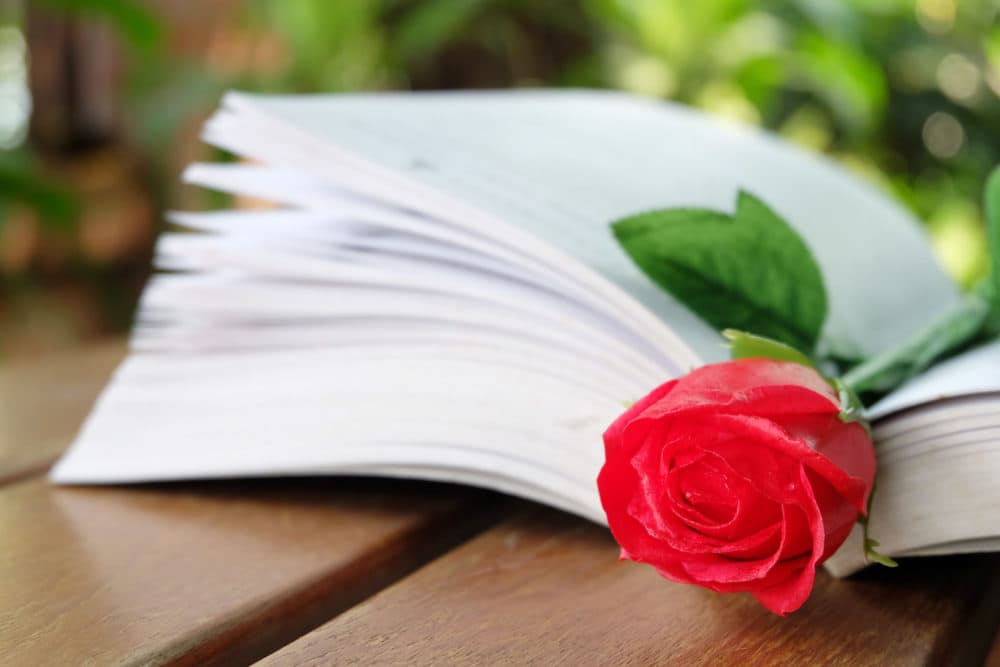 A rose on a book. (Getty Images)