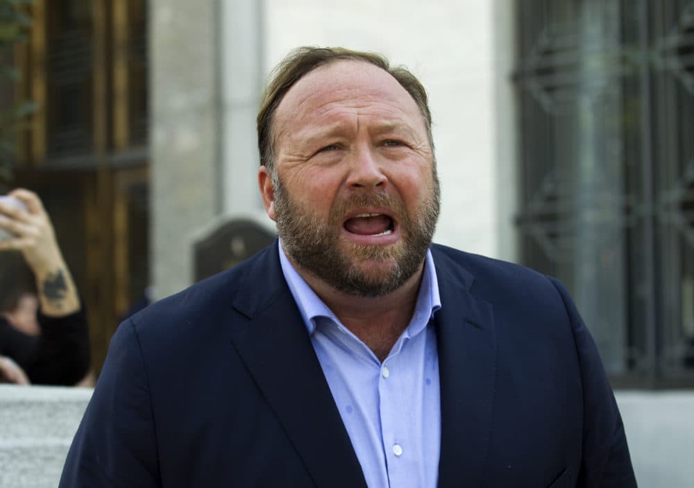 FILE - Alex Jones speaks to reporters in Washington, Sept. 5, 2018. Infowars filed for Chapter 11 bankruptcy protection on April 17, 2022, in Texas as its founder and conspiracy theorist Alex Jones faces defamation lawsuits over his comments that the Sandy Hook Elementary School shooting was a hoax. (Jose Luis Magana?AP File)