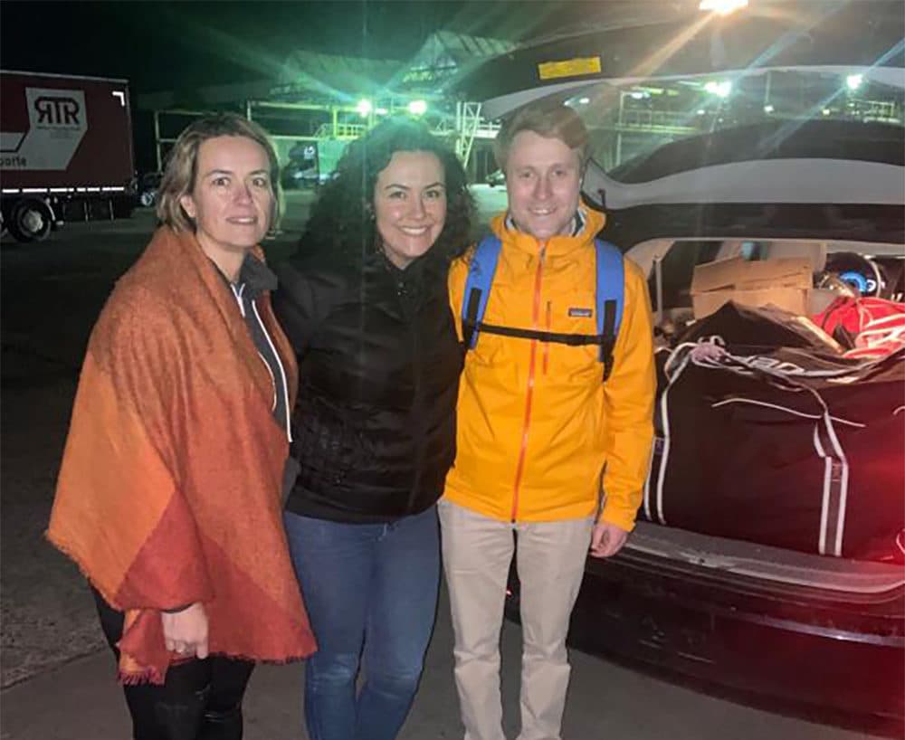 Annissa Essaibi George, left, and her sister Sonia are shown meeting Yuri Kosmyna in Ukraine, just over the border from Poland, last week. The sisters brought hockey bags filled with supplies to help people displaced by the Russian invasion. (Courtesy Annissa Essaibi George via Dorchester Reporter)