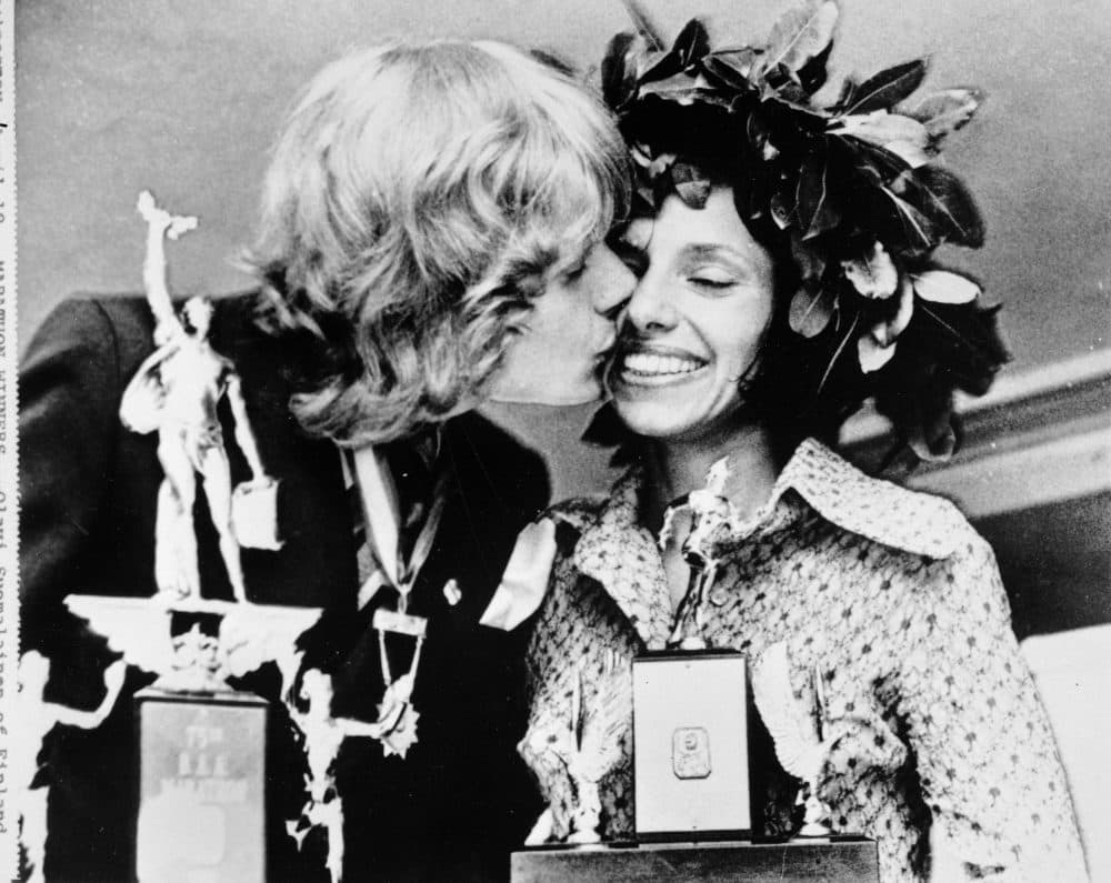Olavi Suomalainen of Finland, winner of the men's division of the Boston Marathon in 1972, kisses Nina Kuscsik of Long Island, N.Y., winner of the women's division, at the trophy presentation. As the 2022 Boston Marathon celebrates the 50th anniversary of the first official women’s race, the occasion will be marked by one of the strongest women’s fields ever. (AP file photo)