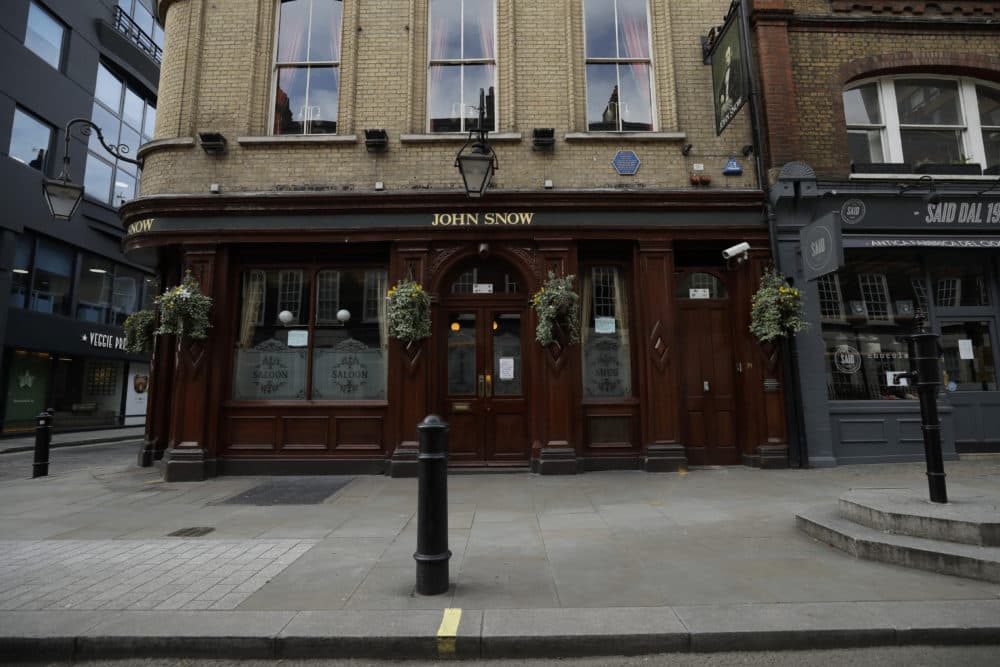 The John Snow pub with a replica of the original water pump, at right, that in 1854 Dr John Snow tracked down as the drinking water source of a cholera outbreak that killed more than 500 people, the first time anyone had identified cholera as a water-borne disease, on Broadwick Street, in the Soho area of central London. Snow is considered one of the founders of modern epidemiology. (Matt Dunham/AP)