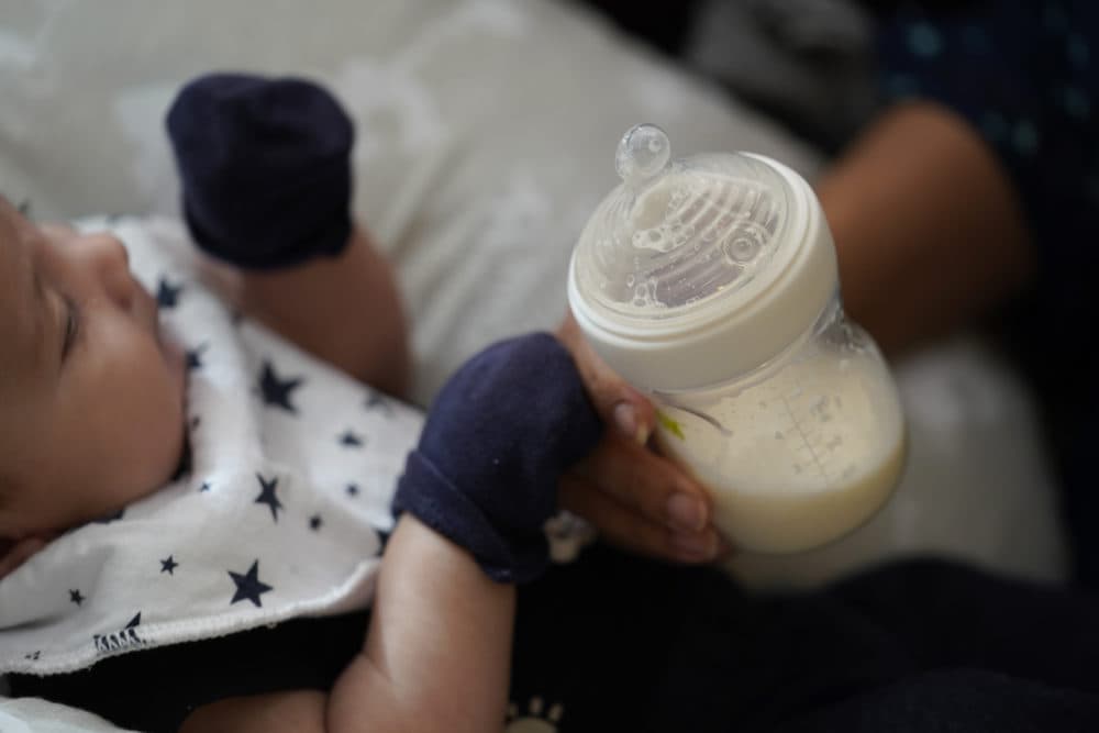 Olivia Godden holds a bottle of baby formula as she feeds her infant son, Jaiden, Friday, May 13, 2022, in San Antonio. Godden has reached out to family and friends as well as other moms through social media in efforts to locate needed baby formula which is in short supply. (Eric Gay/AP)