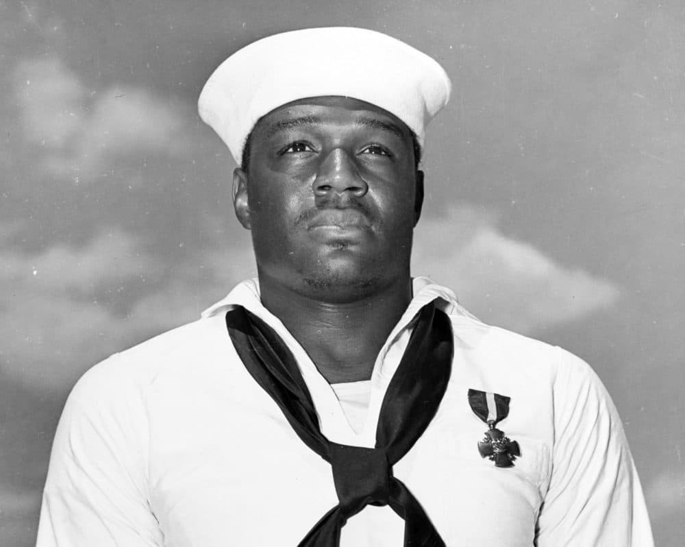 A sailor looks up in this official U.S. Navy photograph. (National Archives, via Naval History and Heritage Command)