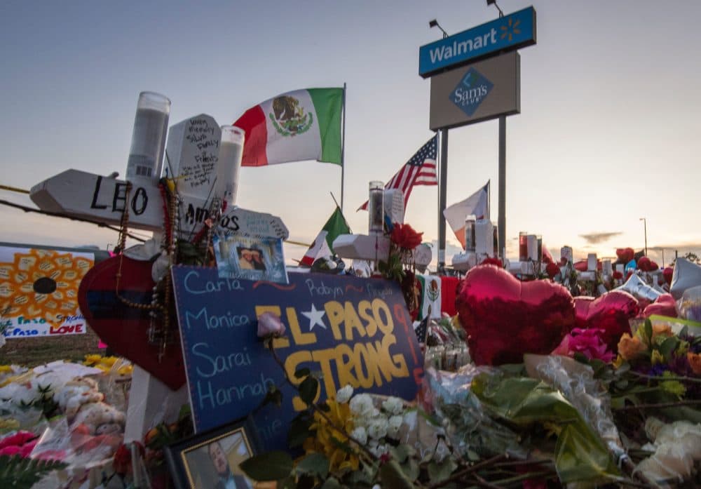 People pray and pay their respects at the makeshift memorial for victims of the shooting that left a total of 22 people dead at the Cielo Vista Mall WalMart in El Paso, Texas, on August 6, 2019. (Mark Ralston/AFP via Getty Images)
