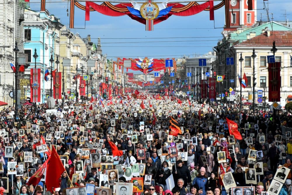 People carry portraits of their relatives - WWII soldiers - as they take part in the Immortal Regiment march in central Saint Petersburg on May 9, 2022.(Olga Maltseva/AFP via Getty Images)