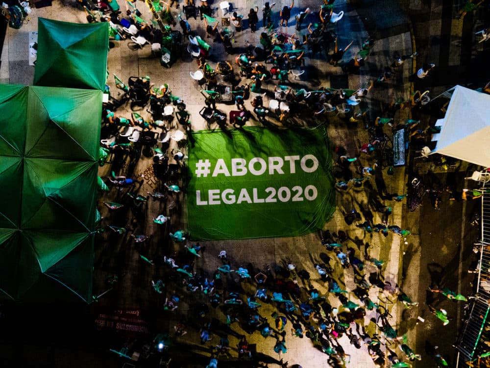 Aerial view of pro-choice activists displaying a banner that reads in Spanihs 'Legal Abortion' outside the National Congress as Deputies vote on a bill to legalize abortion on December 10, 2020 in Buenos Aires, Argentina. (Tomas Cuesta/Getty Images)