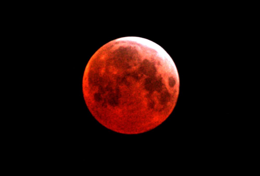 The moon will appear to turn red at about 11:29 p.m. Eastern Time on Sunday night. (Abid Katib/Getty Images)