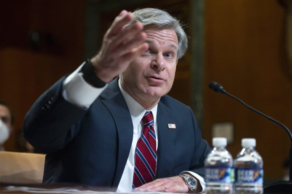 FBI director Christopher Wray testifies during a Senate Appropriations Subcommittee hearing in Washington, on May 25, 2022. Wray says his agents thwarted a planned cyberattack on a Boston children's hospital that was to have been carried out by hackers sponsored by the Iranian government. (Bonnie Cash/Pool Photo via AP, File)