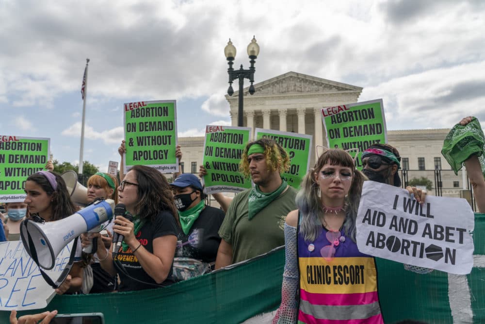 Abortion-rights protesters following Supreme Court's decision to overturn Roe v. Wade, federally protected right to abortion, in Washington, Friday, June 24. (Gemunu Amarasinghe/AP)