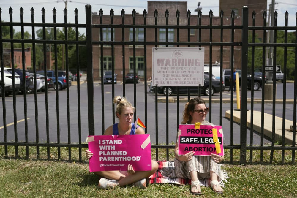 Protesters Kendal Underwood, left, and Brittany Nickens gather outside Planned Parenthood Friday, June 24, 2022, in St. Louis.(Jeff Roberson/AP)