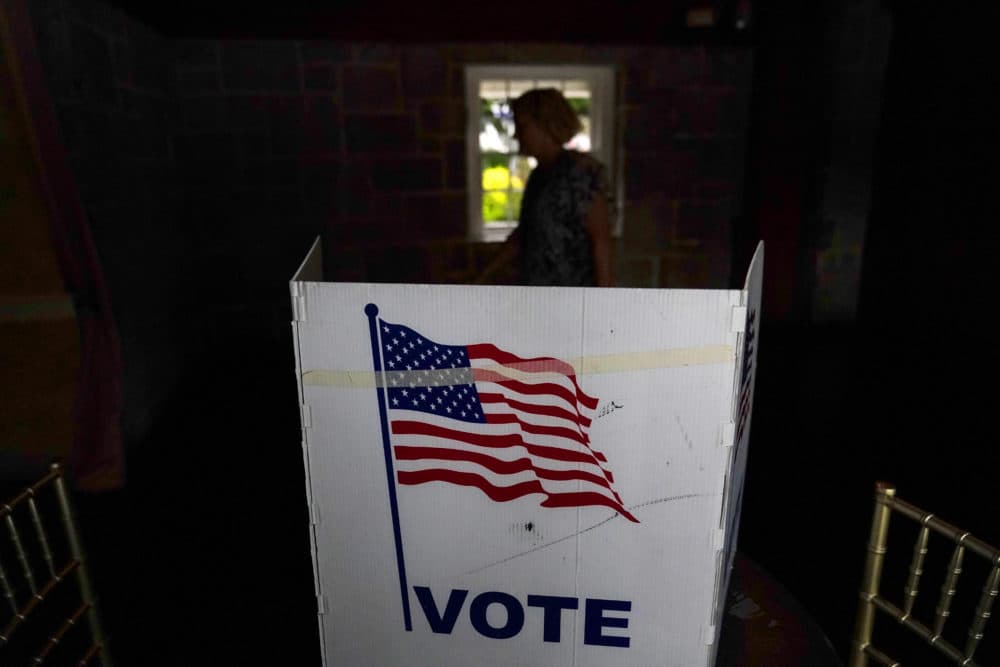 A person waits in line to vote in the Georgia's primary election on May 24, 2022, in Atlanta. More than 1 million voters across 43 states have switched to the Republican Party over the last year, according to voter registration data analyzed by The Associated Press. (Brynn Anderson/AP File)