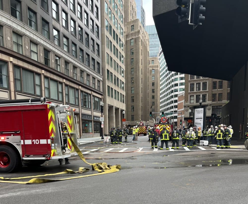 Boston firefighters and other first responders were on scene downtown at the site of manhole explosions on Thursday morning. At least one person was injured. (Courtesy Massachusetts State Police via Twitter)