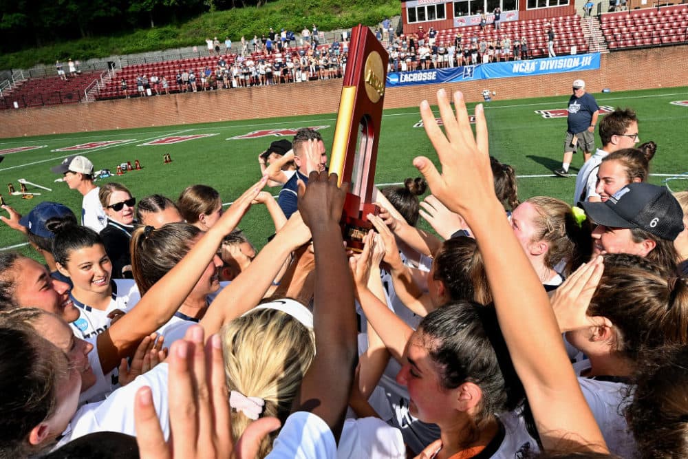 Middlebury College Panthers players celebrate with the trophy after their win against the Tufts University Jumbos during the Division III Women’s Lacrosse Championship held at Kerr Stadium on May 29, 2022 in Salem, Virginia. Middlebury won 13-5. (Photo by Grant Halverson/NCAA Photos via Getty Images)