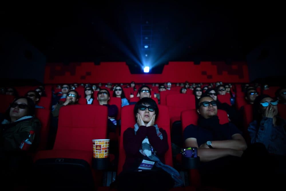 People watching a movie at a cinema in Wanda Group's Oriental Movie Metropolis in Qingdao, China's Shandong province. ( Wang Zhao/AFP via Getty Images)