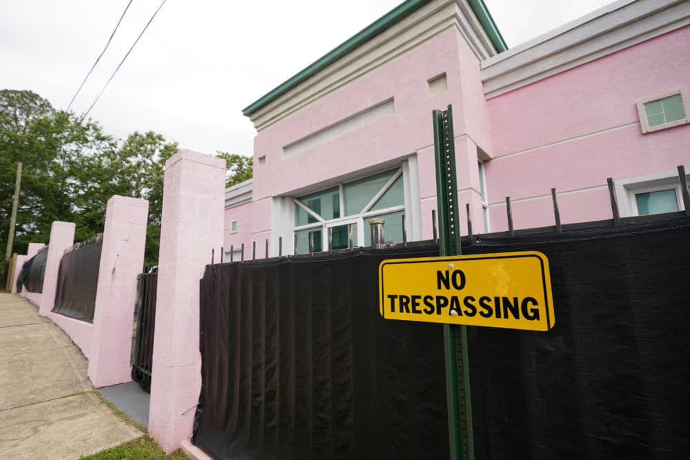 The Jackson Women's Health Organization clinic, a state-licensed abortion clinic in Jackson, Miss., is seen on May 19, 2021. Also known as &quot;The Pink House,&quot; it is shrouded with a black tarp so that its clients may enter in privacy. (Rogelio V. Solis, AP)