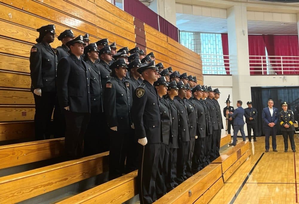 Officers at a police graduation ceremony on June 16, 2022, with Mayor Domenic Sarno and Police Superintendent Cheryl Clapprood (right) looking on. (Courtesy City of Springfield via Facebook)