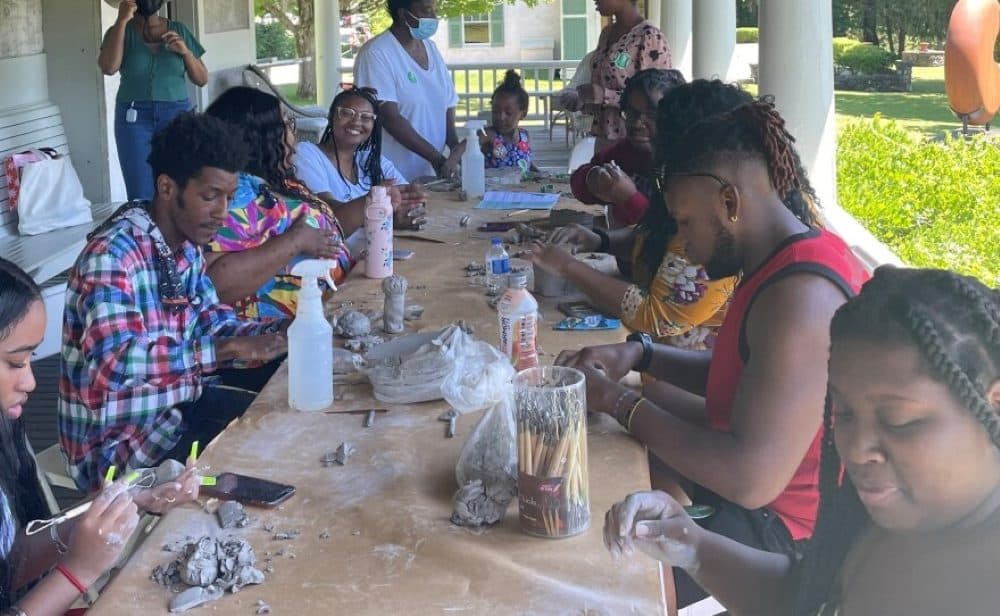 A sculpting class in Chesterwood in Stockbridge, Massachusetts, was part of an event hosted by the Berkshire Black Economic Council (New England Public Media)