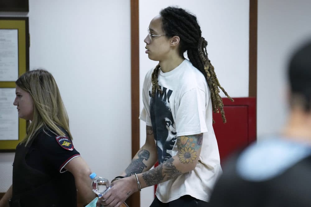 WNBA star and two-time Olympic gold medalist Brittney Griner is escorted to a courtroom for a hearing, in Khimki just outside Moscow, Russia, Friday, July 1, 2022. U.S. basketball star Brittney Griner is set to go on trial in a Moscow-area court Friday. The proceedings that are scheduled to begin Friday come about 4 1/2 months after she was arrested on cannabis possession charges at an airport while traveling to play for a Russian team. (Alexander Zemlianichenko/AP)
