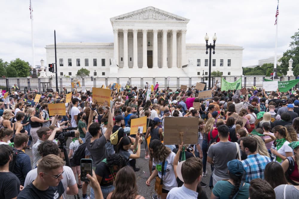Protesters gather outside the Supreme Court in Washington after the U.S. Supreme Court revoked the federal right to an abortion that's been in place for half a century. (Jacquelyn Martin/AP)