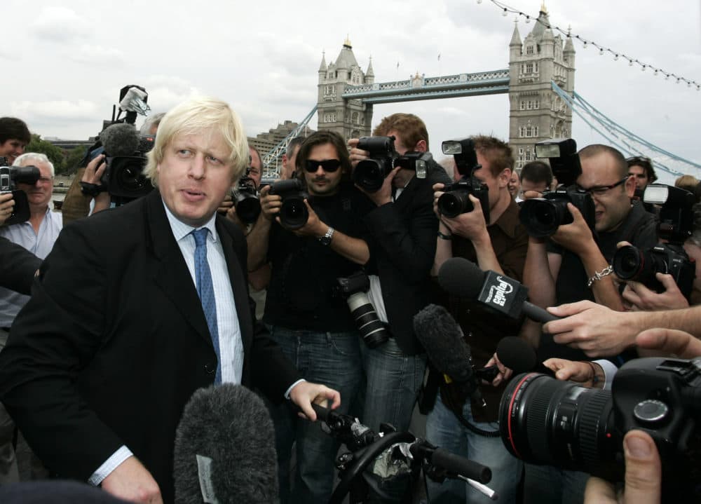 Britain Conservative Party MP, Boris Johnson, left, speaks to the media to launch his campaign as a candidate to be the Mayor of London, outside City Hall in central London, Monday, July 16, 2007. (Sang Tan/AP File)
