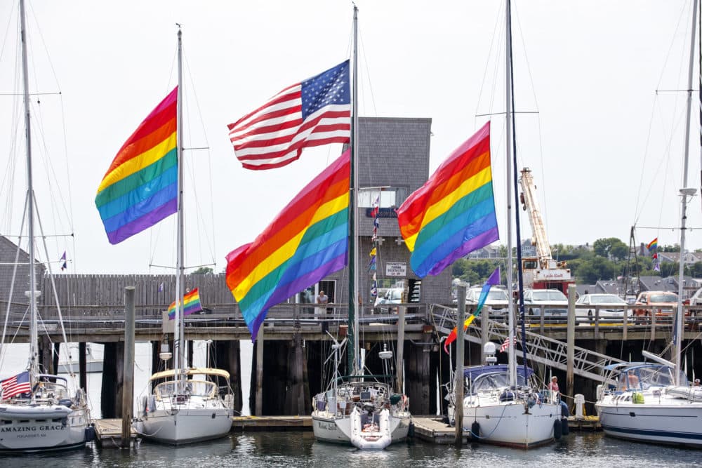 Gay pride flags fly over the harbor in Provincetown, Mass., Thursday, July 10, 2014. (J. Scott Applewhite/AP)