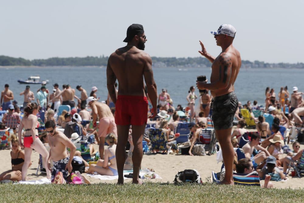 Crowds gather on L Street Beach, Saturday, June 5, 2021, in the South Boston neighborhood of Boston. The temperature reached near 90 degrees. (Michael Dwyer/AP)