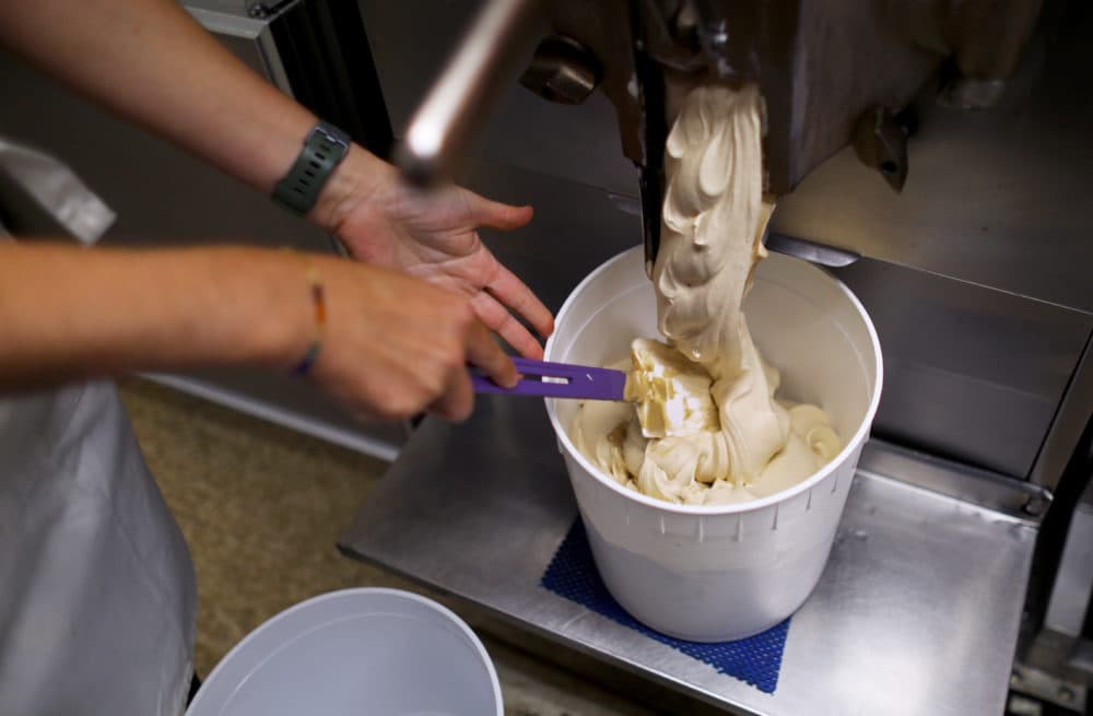Coffee ice cream is scooped at The Ice Creamsmith in Dorchester. (Photo by Pat Greenhouse/The Boston Globe via Getty Images)