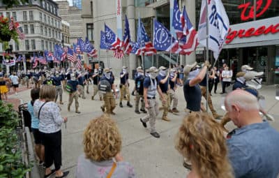 The white supremacist group, The Patriot Front, marches thru the city of Boston on July 2. Experts say right-wing groups like Patriot Front and NSC-131 espouse similar religious language and ideas to those found in Christian nationalism. (Stuart Cahill/MediaNews Group/Boston Herald via Getty Images)
