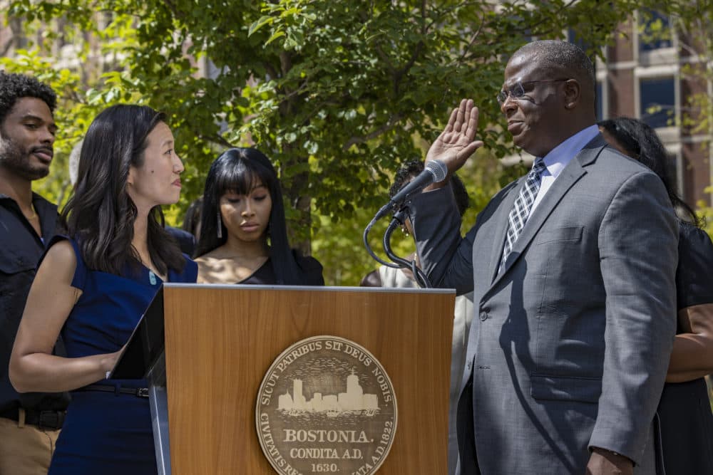 Mayor Michelle Wu swears in Michael Cox as Boston police commissioner at a ceremony on City Hall Plaza Monday. (Jesse Costa/WBUR)