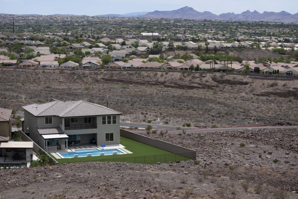 A home with a swimming pool abuts the desert on the edge of the Las Vegas valley. (John Locher/AP)