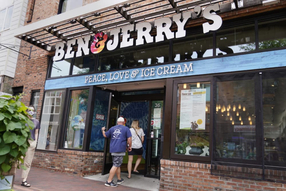 Two patrons enter a Ben & Jerry's Ice Cream shop, July 20, 2021, in Burlington, Vermont (Charles Krupa/AP)