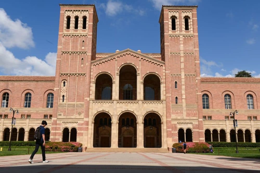 A student walks toward Royce Hall on the campus of University of California at Los Angeles (UCLA) in Los Angeles, California on March 11, 2020. (Robyn Beck /AFP via Getty Images)