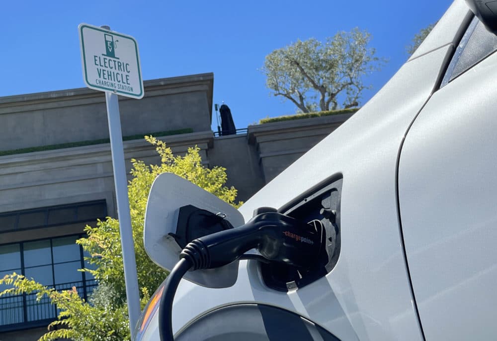 An electric car charges at a mall parking lot. (Justin Sullivan/Getty Images)