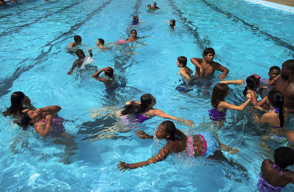 Kids enjoyed the cool of the water at Dilboy Pool in Somerville, Mass. on a hot afternoon, July 7, 2014. (Dina Rudick/The Boston Globe via Getty Images)