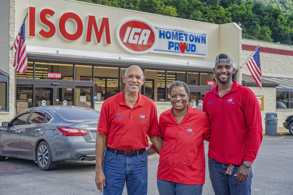Arthur, Gwen and Simon Christon, from left to right, in front of Isom IGA. Gwen Christon started there as a cashier there in 1973. (Mountain Association)