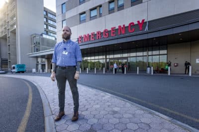 David Cave, a recovery coach who is part of a new addiction specialty team at Salem Hospital, stands outside of the emergency department. (Jesse Costa/WBUR)