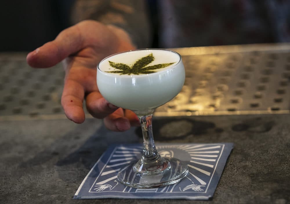 A drink containing Cannabidol CBD extract with a marijuana leaf motif. (Damian Dovarganes/AP)